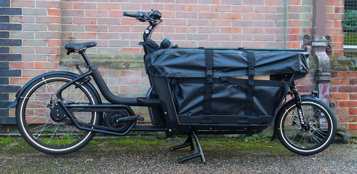 Black electric delivery bike with large front storage